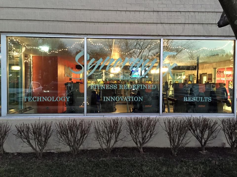 SynerFX store front with window film custom graphics